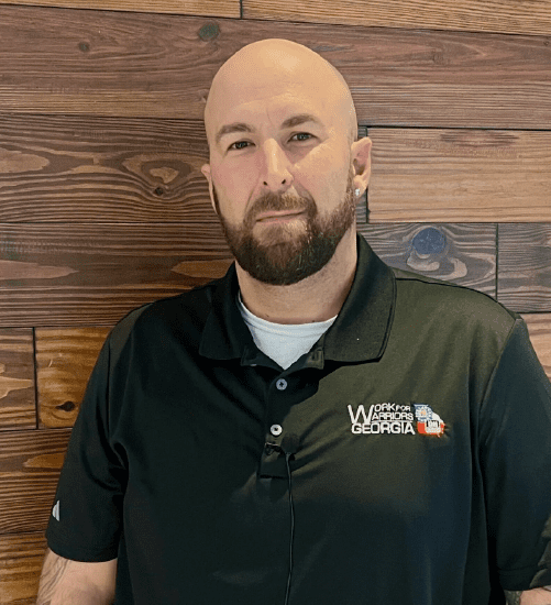 A man with a beard wearing a black shirt